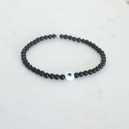 Bracelet oeil et pierres onyx noires rondes,bracelet élastique porte bohneur tailles à choisir