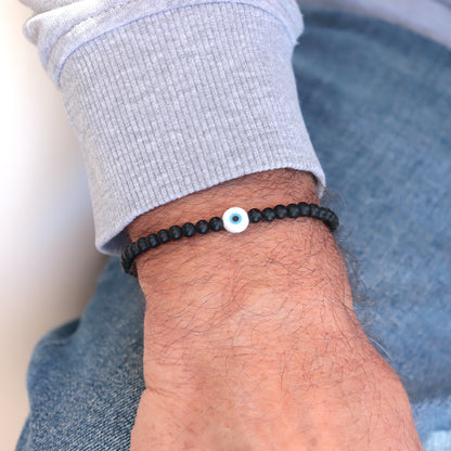 Bracelet oeil et pierres onyx noires rondes,bracelet élastique porte bohneur tailles à choisir